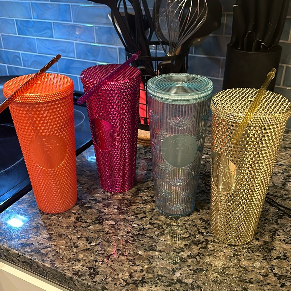 Four Starbucks cup